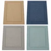 Bordered flatweave rug in tan, navy, grey and aqua