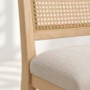 Close-up of woven cane back and padded seat