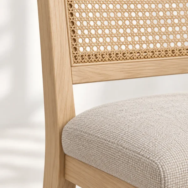 Close-up of woven cane back and padded seat
