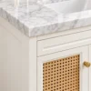 Close-up of woven cane door and marble top