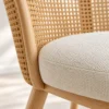Close-up of curved woven cane back and padded seat