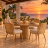 Curved cane dining chairs at a villa table with sea view