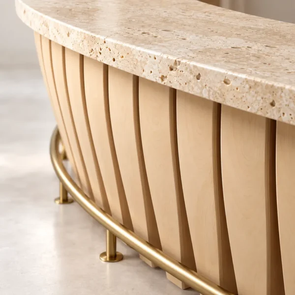 Close-up of travertine bar top, plywood staves and brass foot rail