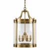 Tall brass cylinder glass lantern pendant with four candle lights