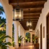Row of glass lantern pendants in a colonial boutique hotel hallway