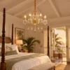 Crystal candle chandelier in a boutique hotel suite bedroom