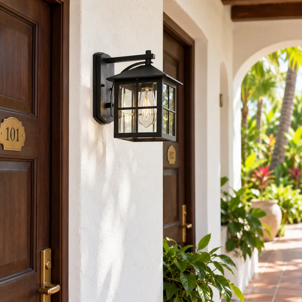Black grid glass wall lantern between guest room doors in a hotel corridor