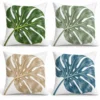 Monstera leaf pillow in deep green, sage, sand and ocean blue