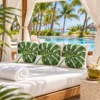 Monstera leaf pillows in a hotel poolside cabana