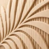 Close-up of carved palm leaf on plywood slat panel