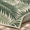 Close-up of woven palm leaf pattern and rug edge