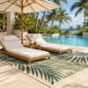 Palm leaf rug on a hotel pool deck