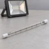 R7S halogen lamp beside a compatible fixture for illustrative reference