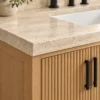 Close-up of reeded oak doors and travertine top
