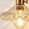 Close-up of ribbed glass shade with scalloped edge