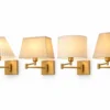 Swing arm wall sconce with four fabric shade styles