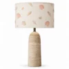 Travertine column table lamp with seashell print shade
