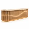 Custom reception desk with wave plywood slice front and travertine top