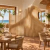 Wave slice room divider between dining areas in a hotel restaurant