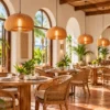 Wood slat pumpkin pendants in a boutique hotel breakfast room