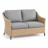 Woven wicker loveseat with grey cushions
